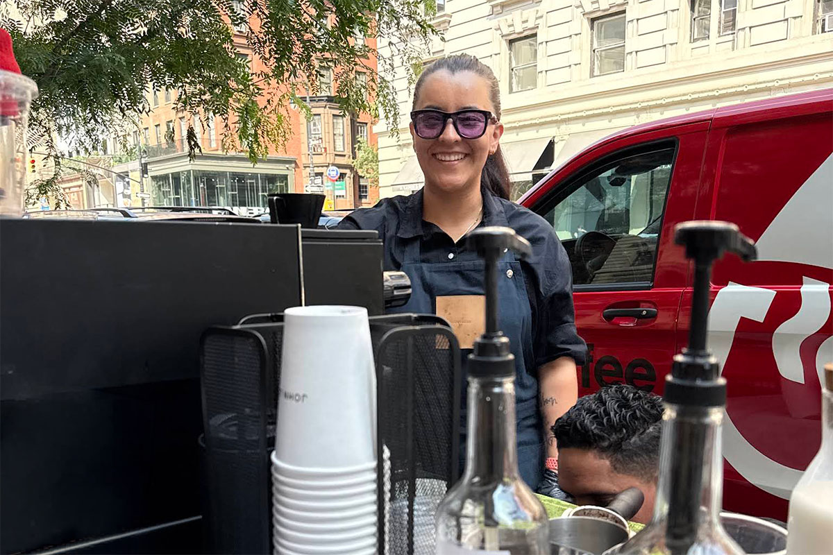 Coffee Malem barista preparing drinks during an outdoor coffee service event.